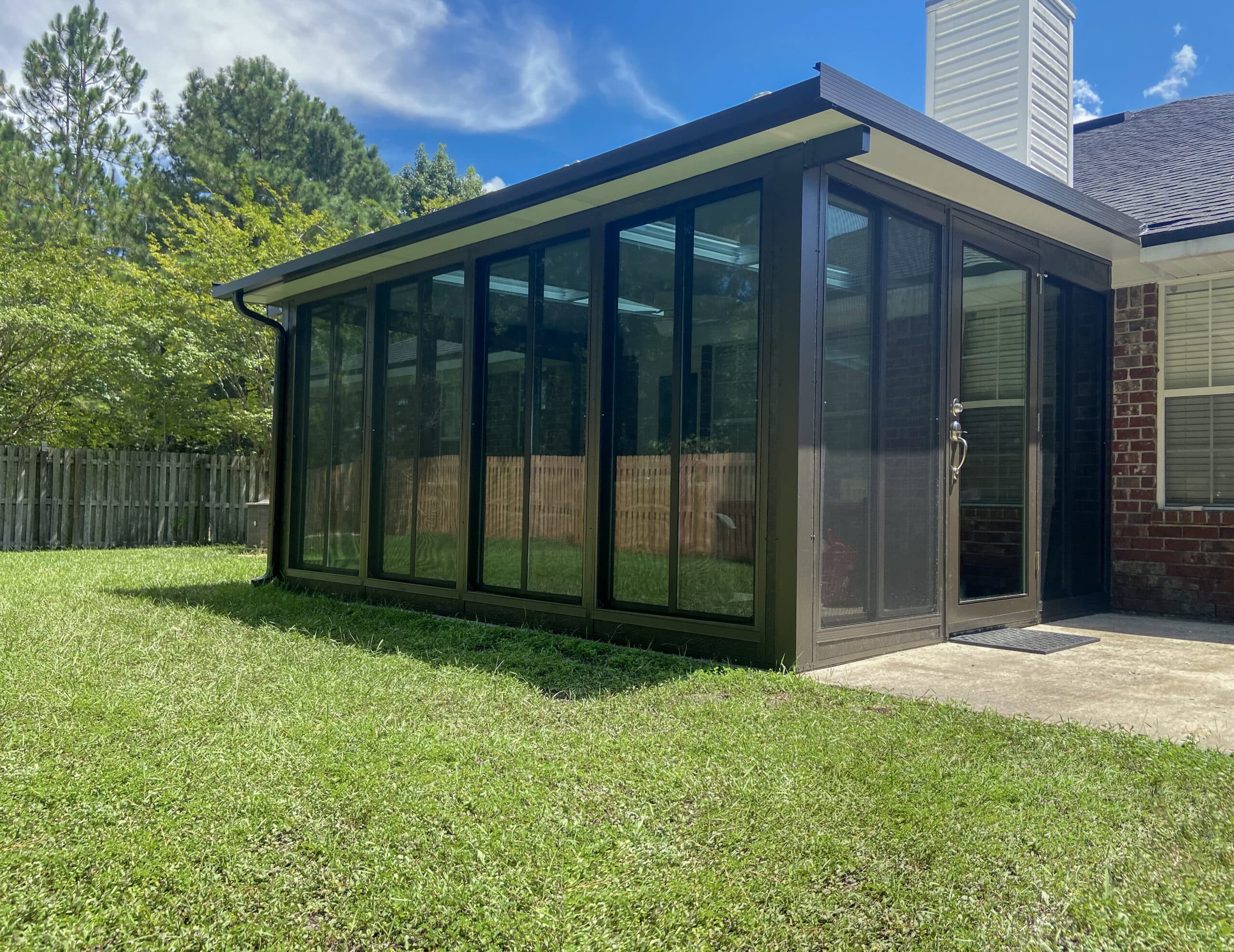 TEMO glass walled studio sunroom with floor to ceiling windows