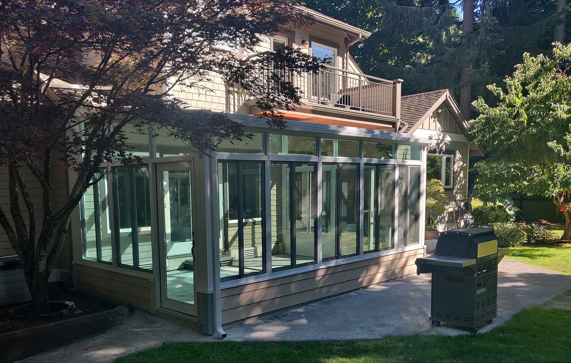 TEMO solid roof sunroom with insulated roof panels on a home exterior